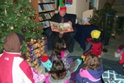 City councillor/ literacy elf Gord Turner reads to the kiddies at City Hall