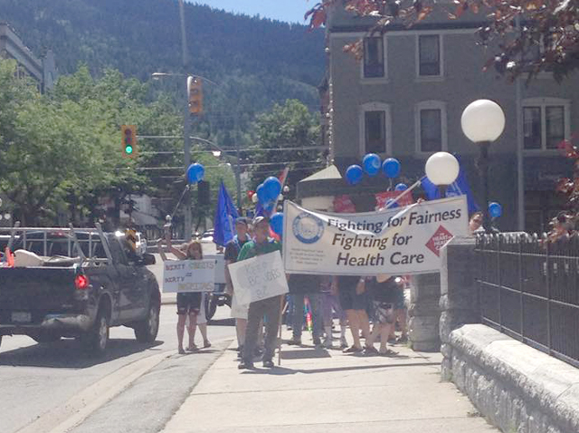 Taking it to the streets: HEU stages rally against privatization of hospital laundry services