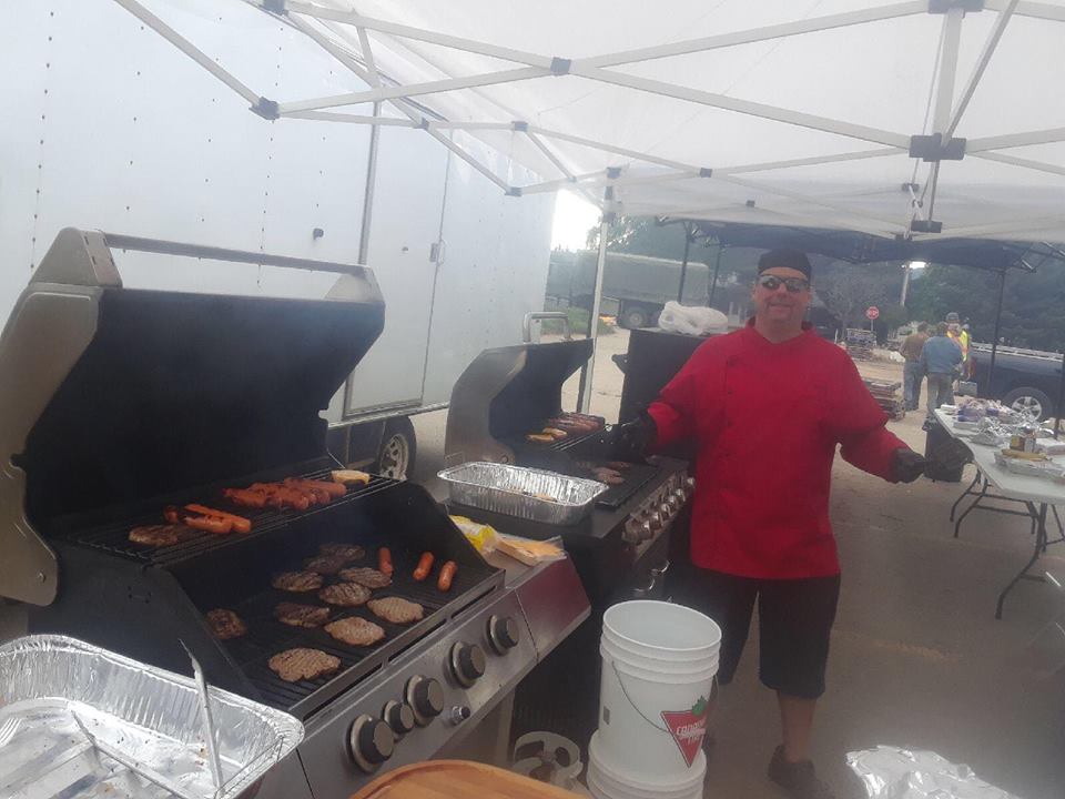 Community BBQ for Grand Forks this afternoon, Castlegar man cooking the cuts